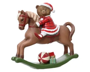 Christmas rocking horse with teddy wearing Santa hat